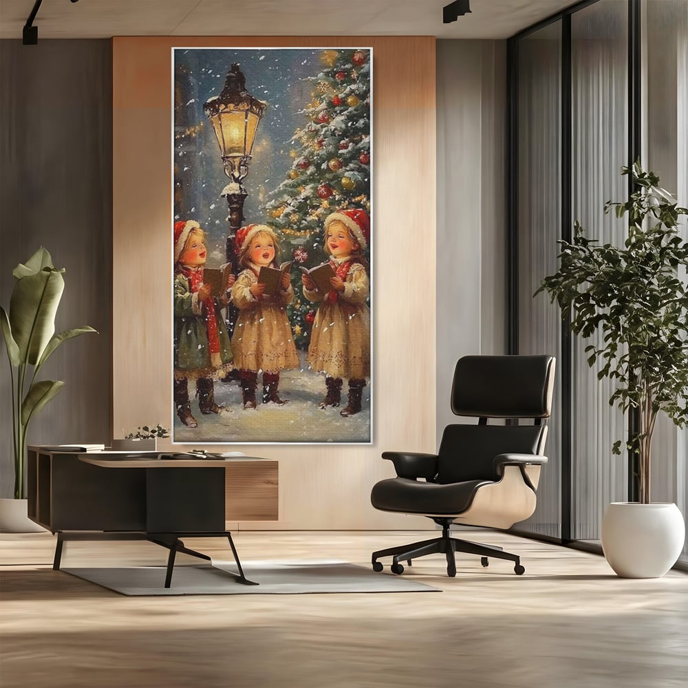 Tablou canvas cu pictura cu trei fetite colindatoare, in rama de aluminiu argintiu, pe perete intr-un birou
